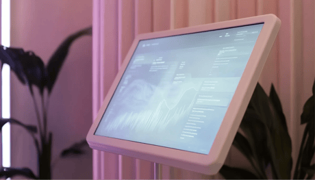 A self-serve kiosk monitor with generic analytics on the screen